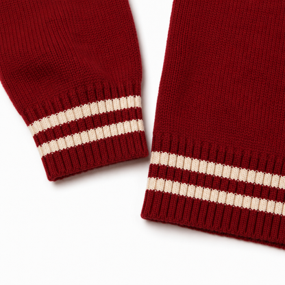Red varsity cardigan with cream striped ribbed cuffs and hem