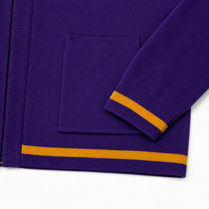 Purple knit cardigan hem and cuff detail with single old-gold stripes and neat ribbed finishing