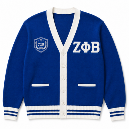 Zeta Phi Beta royal blue cardigan with white trim, Greek letters, striped ribbing, and shield crest 