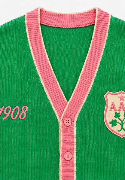 Green V-neck knit cardigan, pink rib placket, "1908" print & embroidered badge
