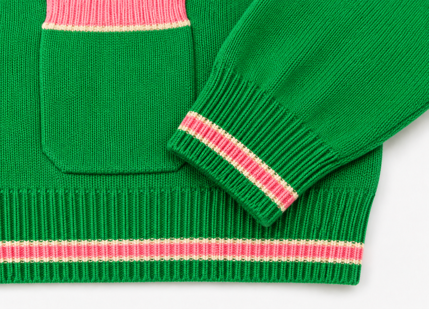 Closeup: green knit pocket & cuff with pink rib trim