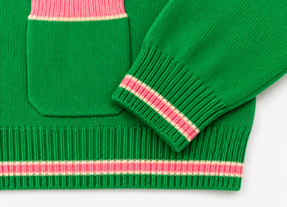 Closeup: green knit pocket & cuff with pink rib trim