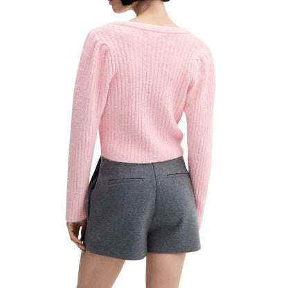 Detailed back view of the pink ribbed knit cardigan, highlighting the ribbed texture, seamless finish, and overall fit.