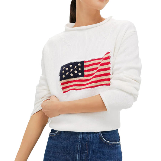 White relaxed crew-neck sweater with a red, cream and navy knitted American flag motif on the chest.