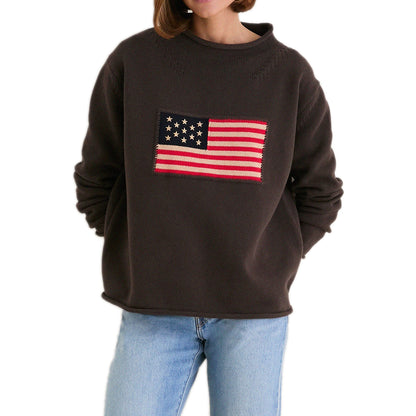 Dark brown relaxed crew-neck sweater with a red, cream and navy knitted American flag motif.