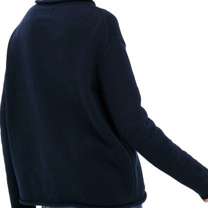 Back view of a navy relaxed long-sleeve knit sweater with a rolled neckline and hem.
