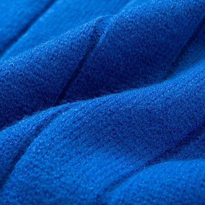 Close-up View of Blue Knit Sweater Fabric, Showcasing the Soft and High-Quality Texture of the Material.