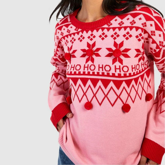 "custom-womens-christmas-sweater-pom-pom-full-view.jpg" "Full view of a custom women's Christmas sweater with red and pink Ho Ho Ho design and pom-poms by PAPAGARMENT"
