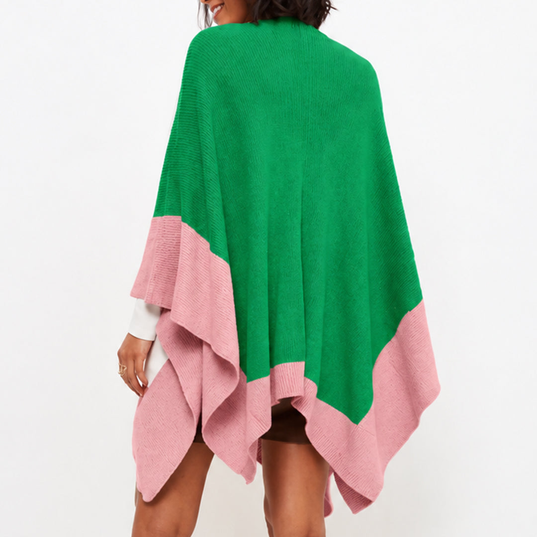 Back view of green poncho cardigan with pink border