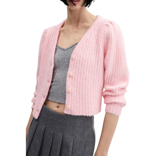 Casual yet chic outfit featuring a pink ribbed knit cardigan with a button-up front, worn over a grey crop top and paired with a grey pleated skirt.