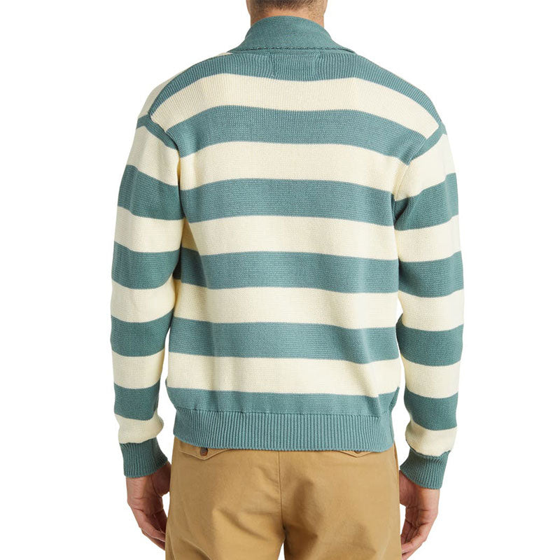 Back view of a model wearing a custom stripe cardigan with green and cream stripes and a turn-down collar.