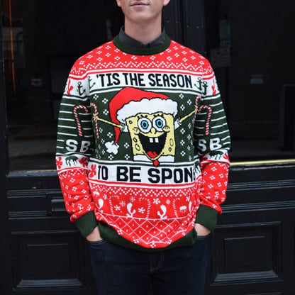 Front view of a person wearing a custom SpongeBob Christmas sweater featuring SpongeBob SquarePants in a Santa hat with the text 'Tis the Season to Be Sponge.
