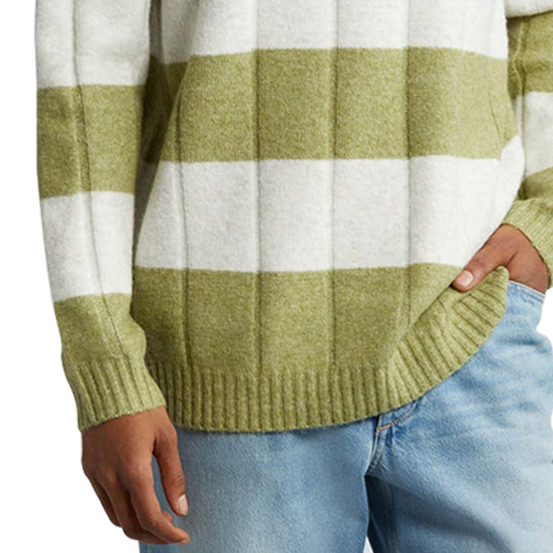 Close-up view of a green and white striped cotton blend knit pullover sweater, highlighting the ribbed cuffs and hem.