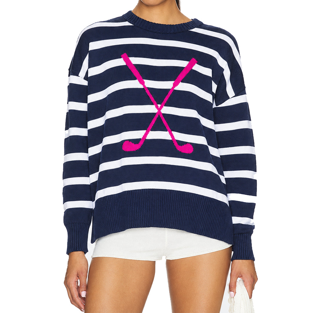 Women's navy and white striped sweater with pink crossed-stick graphic