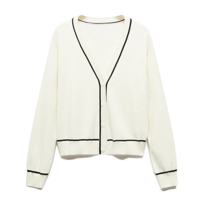 Elegant and versatile white knit cardigan with black trim, ideal for pairing with various outfits for both casual and formal occasions.