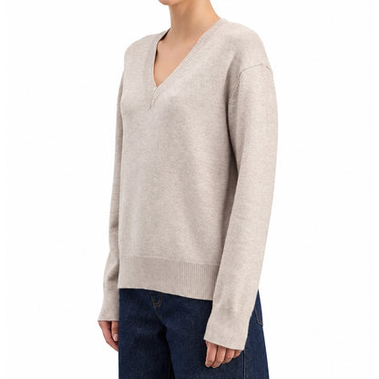Side view of women's textured knit pullover