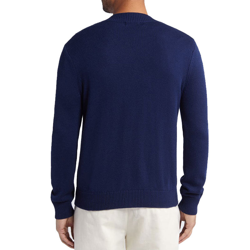 Back view of a navy blue custom cashmere cardigan, showing the solid color and fine knit details.