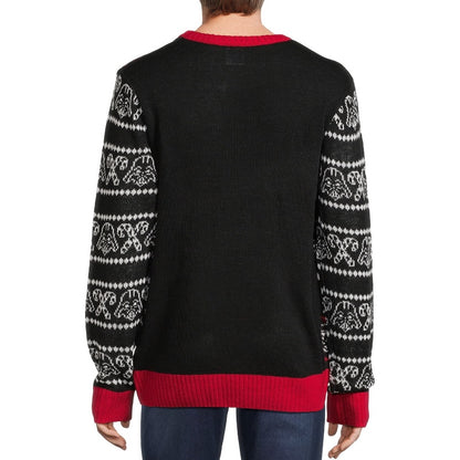Back view of a man wearing a black pullover sweater with black and white patterned sleeves and a plain black back with red accents.