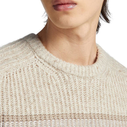 Close-up of the crew neck design on custom cashmere striped knit pullover sweater