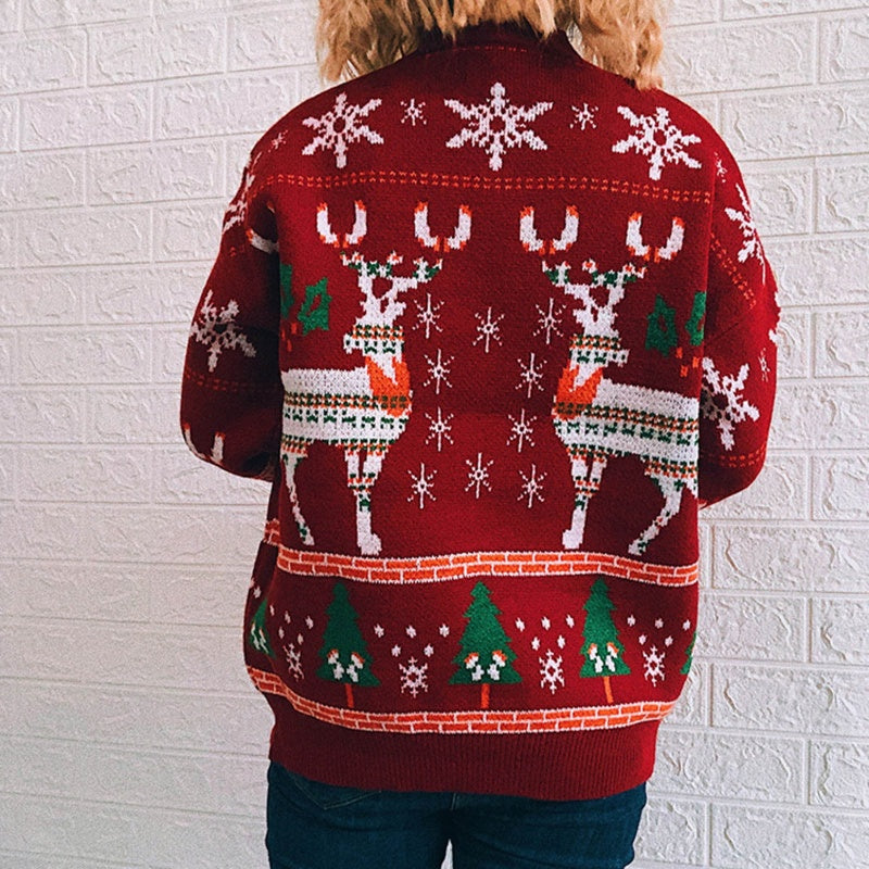 Back view of a person wearing a custom high-quality cashmere sweater featuring a festive reindeer design with snowflakes and Christmas trees.