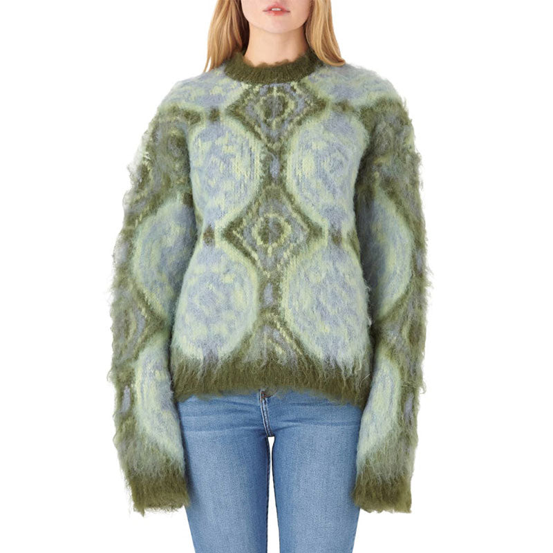 Front view of a woman wearing a cashmere blend knit pullover sweater with a geometric design in green and blue.