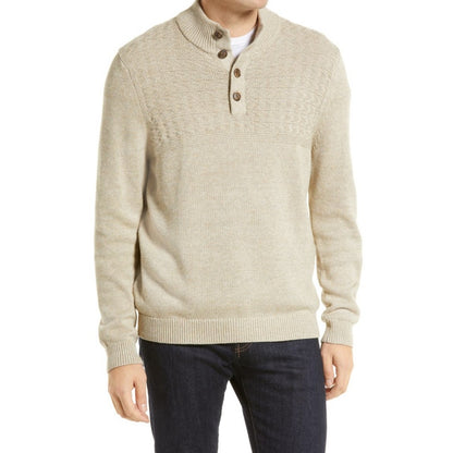 Model wearing a beige wool cashmere blend knit sweater with a button-up collar, showcasing the fit and style of the sweater.