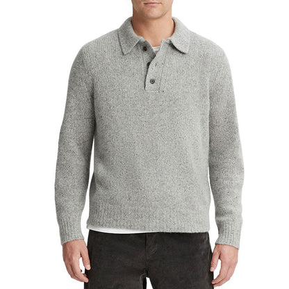 Front view of a man wearing a gray cashmere blend knit pullover sweater with a polo collar and ribbed cuffs and hem.