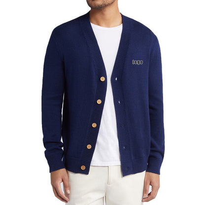 Model wearing a navy blue custom cashmere cardigan with logo, displaying the front design and button details.