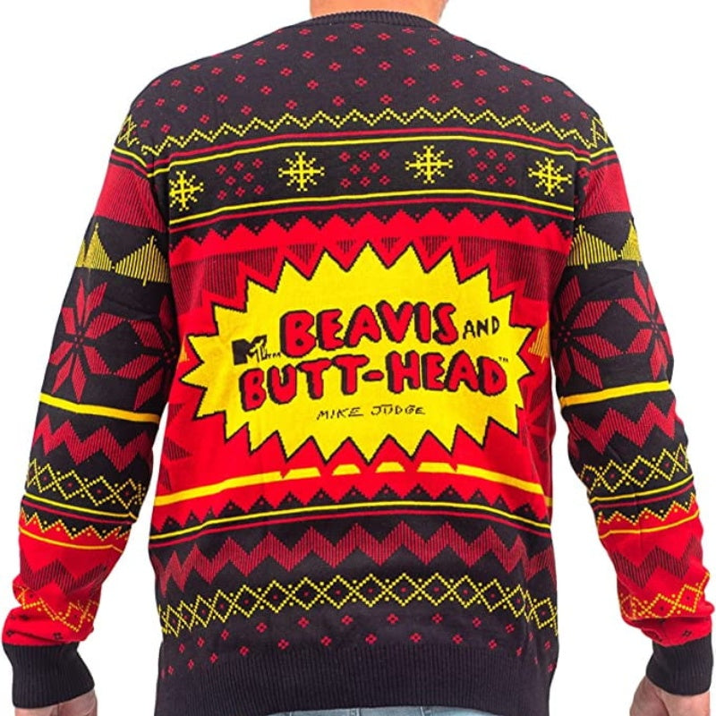 Back view of a man wearing a luxurious cashmere pullover sweater with a festive Beavis and Butt-Head logo design in red, yellow, and black.