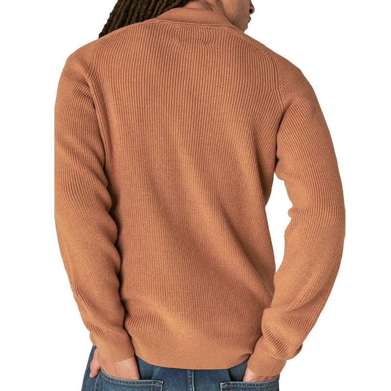 Back view of a man wearing a camel-colored ribbed knit polo sweater, highlighting the texture and fit of the garment.