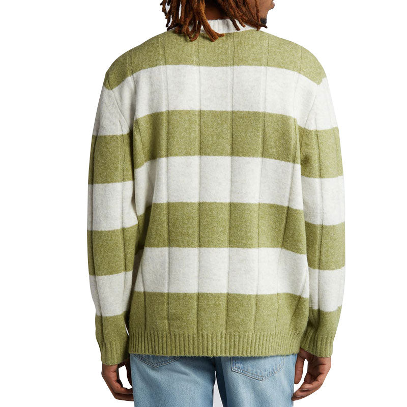 Back view of a man wearing a green and white striped cotton blend knit pullover sweater with a crew neck, ribbed cuffs, and hem.