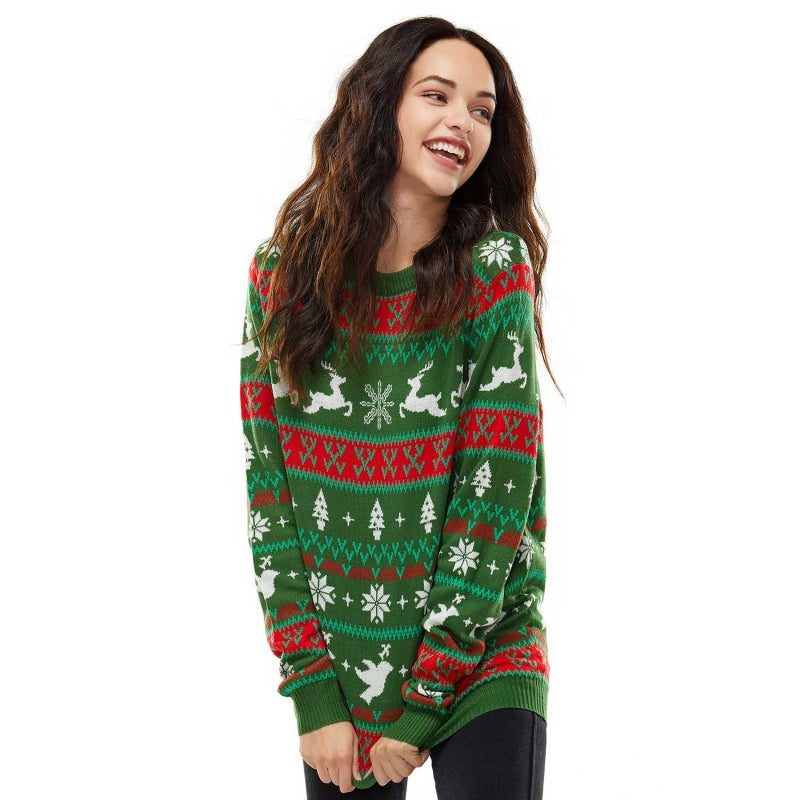 Model wearing a custom 100% cotton couples sweater with a festive Fair Isle design in green, red, and white colors. The sweater features holiday motifs including reindeer, snowflakes, and Christmas trees, perfect for festive celebrations.