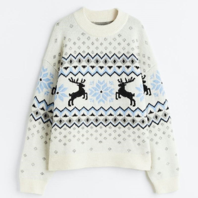 Custom jacquard knit sweater with a reindeer and snowflake design in white, blue, and black colors. The sweater features intricate winter motifs, perfect for the holiday season.