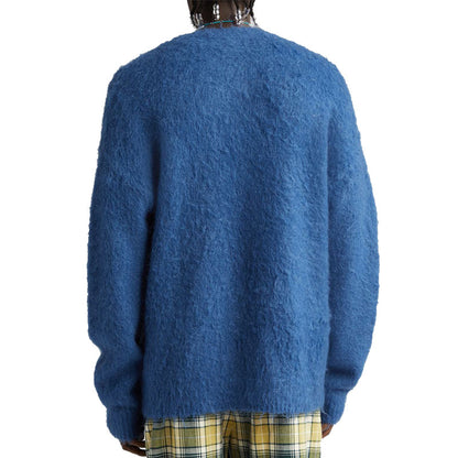 Back view of a man wearing a blue custom wholesale wool blend solid crew neck cardigan sweater