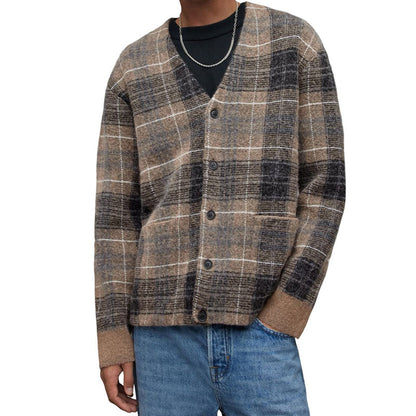 Man wearing a custom wholesale mohair blend V-neck cardigan sweater in brown plaid with blue jeans