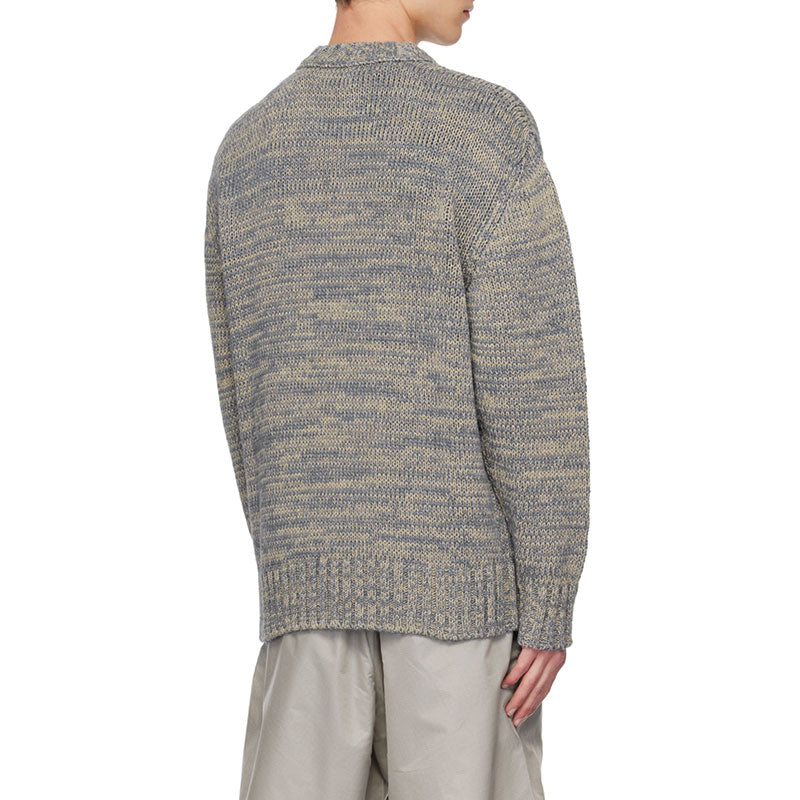 Back view of a custom blue and beige marled knit sweater, highlighting the ribbed detailing and the overall textured design of the fabric.