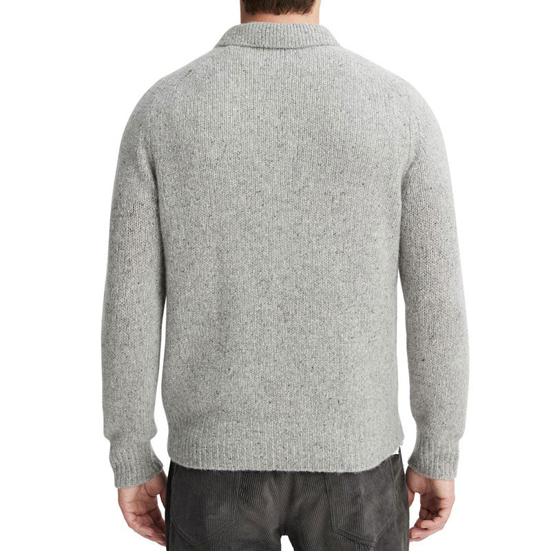 Back view of a man wearing a gray cashmere blend knit pullover sweater with a polo collar and ribbed cuffs and hem.