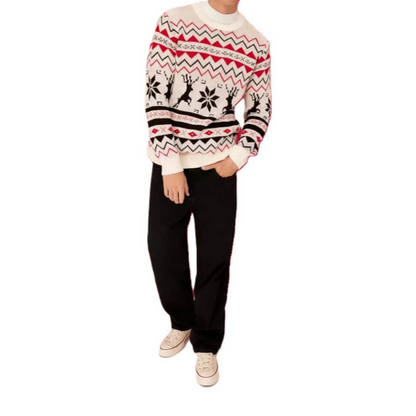"Model wearing a custom 100% cotton men's sweater featuring a festive reindeer and snowflake pattern in red, black, and white. The model is dressed in black pants and white sneakers, showcasing the sweater's holiday design."