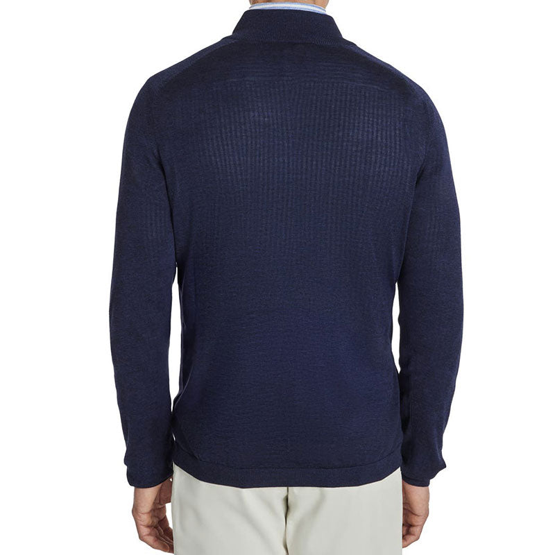 Back view of a man wearing a custom 100% cotton knit sweater in navy blue, highlighting the solid 1/4 zipper polo collar design.